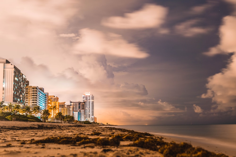 city skyline under cloudy sky during daytime