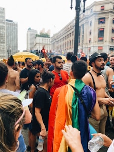 A diverse group of people showcasing vibrant outfits in a stylish urban setting.