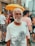 man in white crew neck t-shirt standing near people during daytime