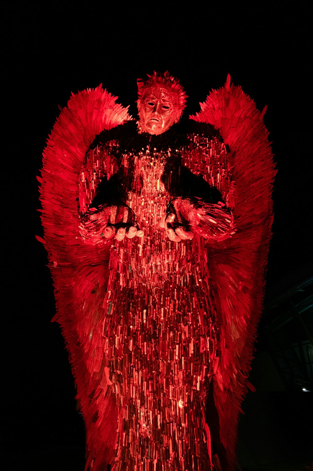 man in red and black dress