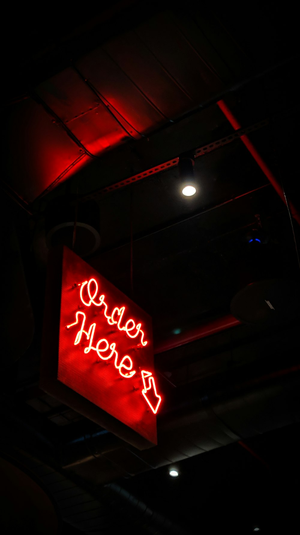 red and white open neon signage