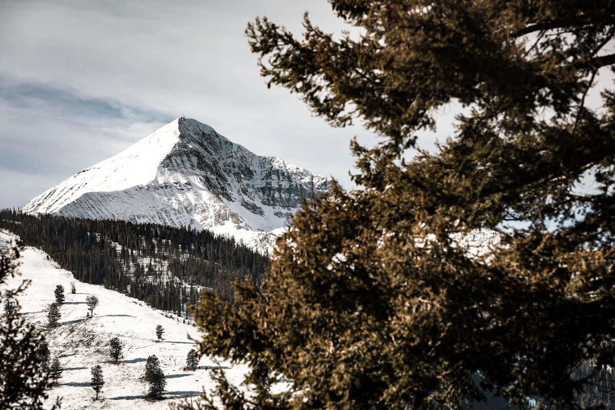Lone Peak with snow and evergreen trees near Big Sky, Montana