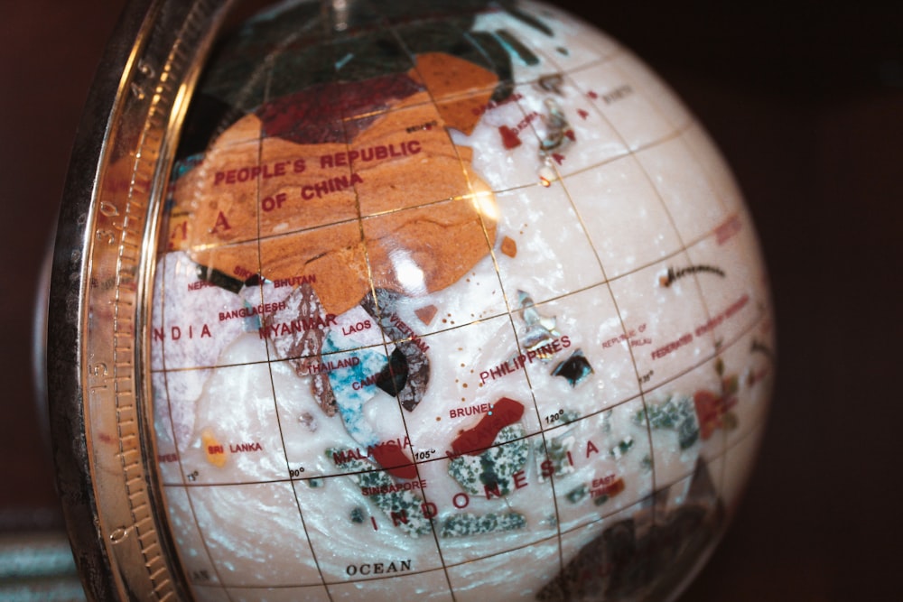 brown and blue globe with white background