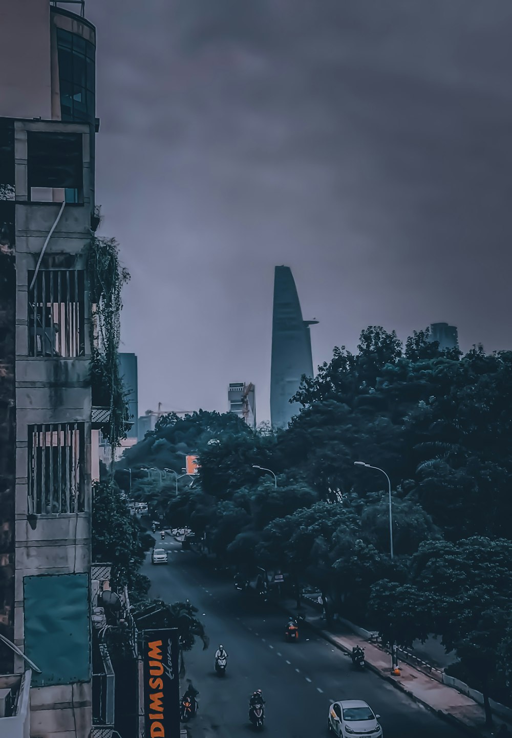 city buildings under gray cloudy sky during daytime