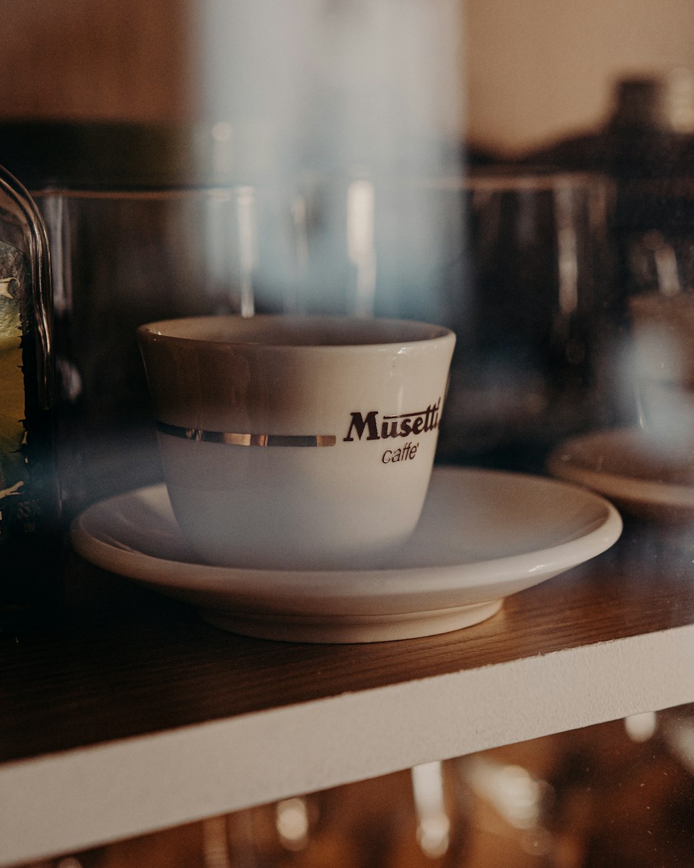 white ceramic cup on white ceramic saucer