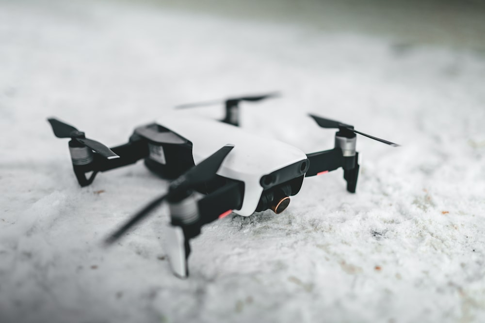 black and white drone on white snow