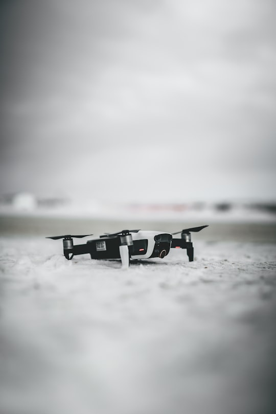 black and white drone flying over the sea in Saskatchewan Canada