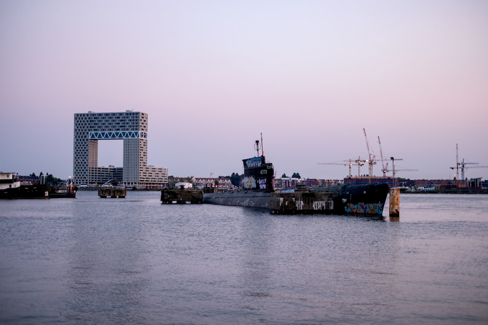 brown and white concrete building near body of water during daytime