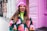 woman in white blue and red sweater wearing pink knit cap