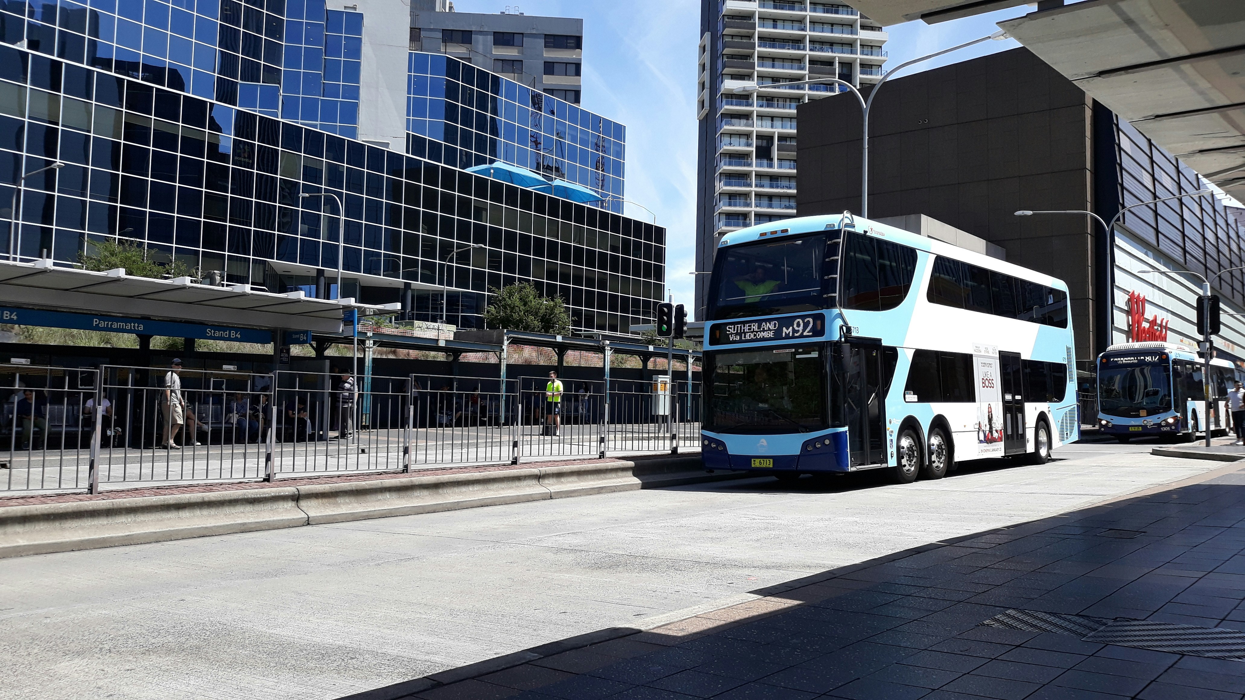 two double decker buses parked in front of a building