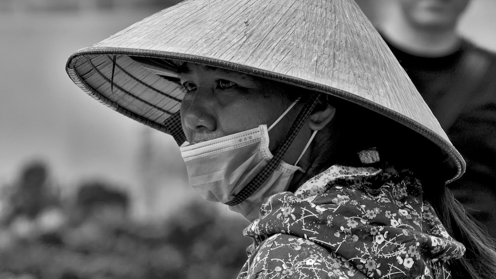 grayscale photo of woman wearing hat