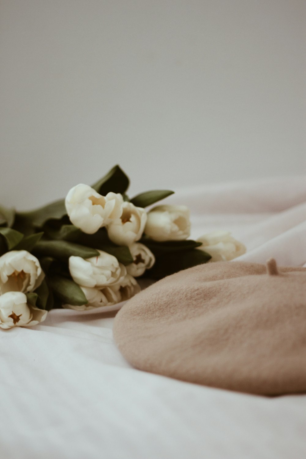 white flowers on brown textile