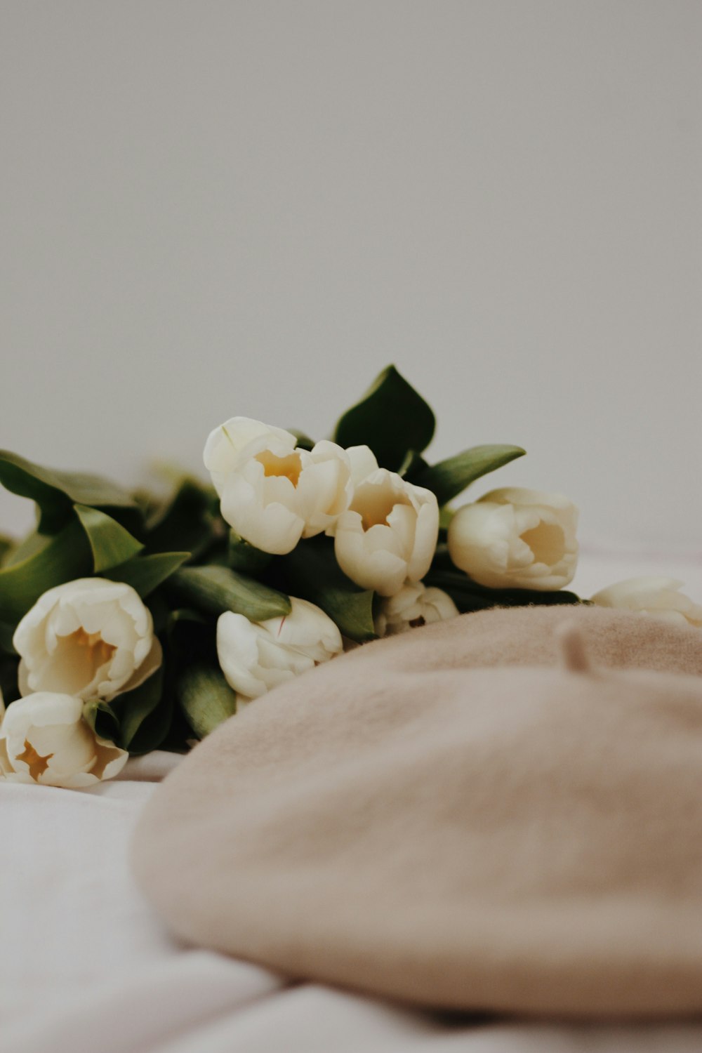 white roses on white textile