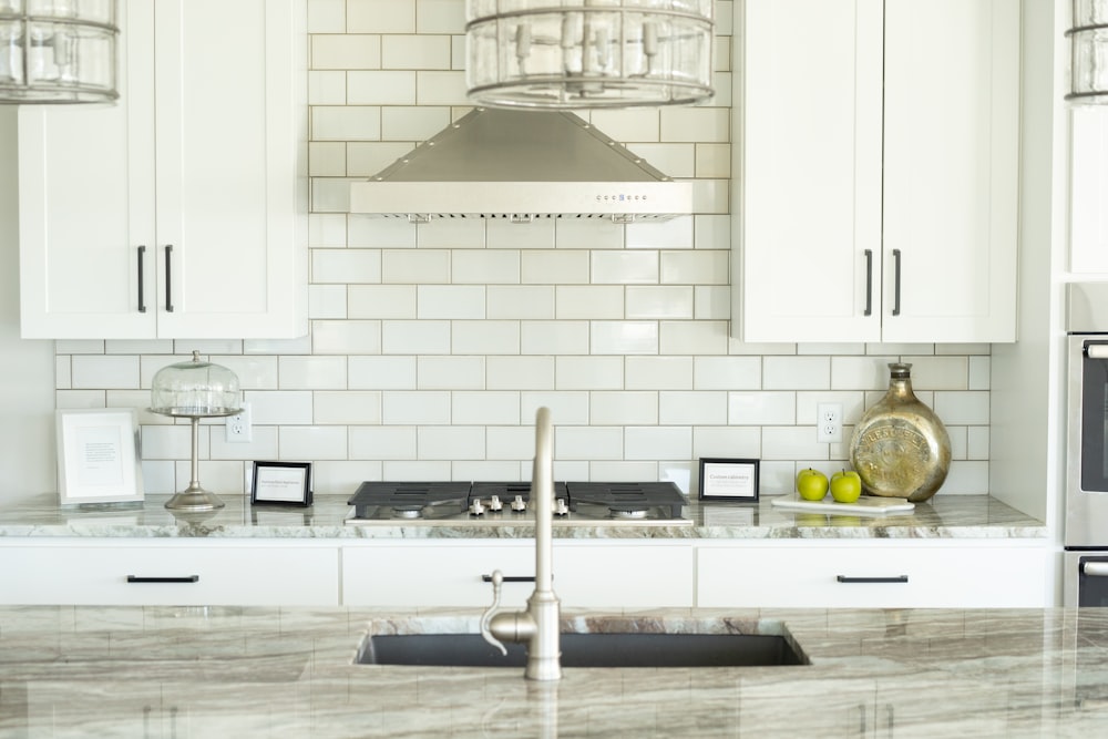 white and silver kitchen sink