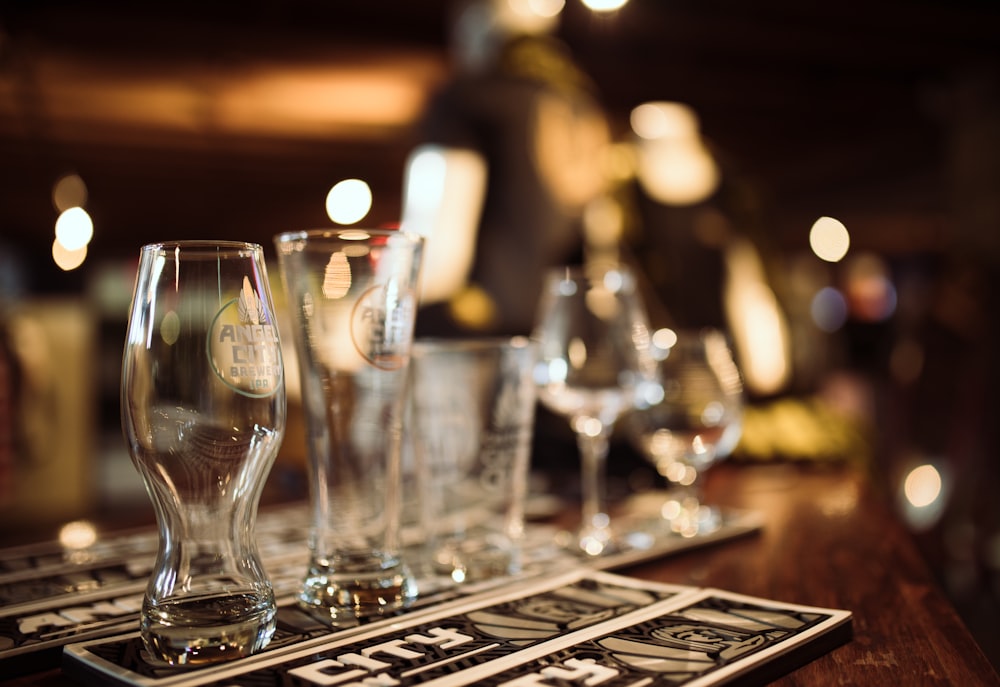 clear drinking glass on brown wooden table