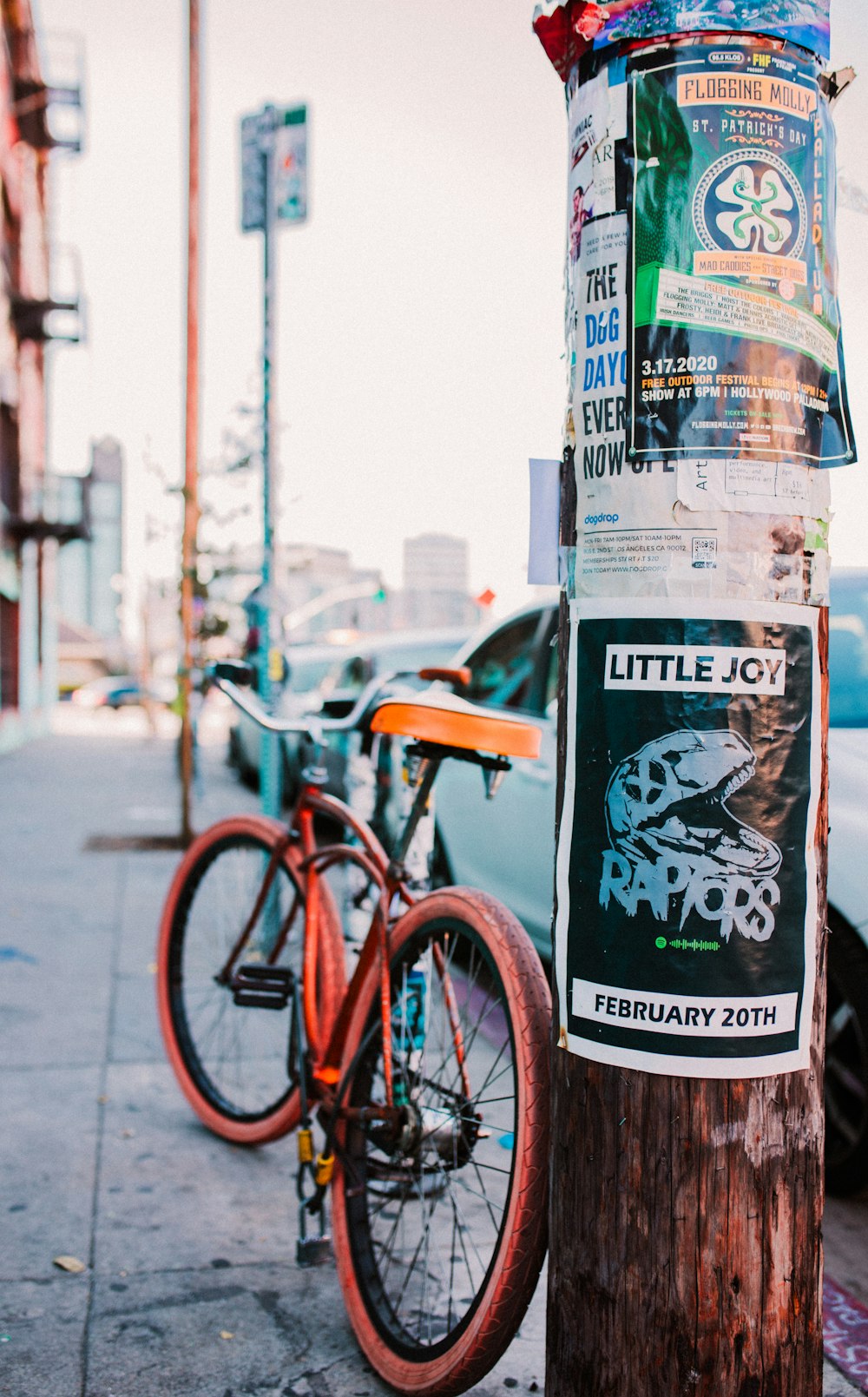 red city bike parked beside white and black kanji text print wall