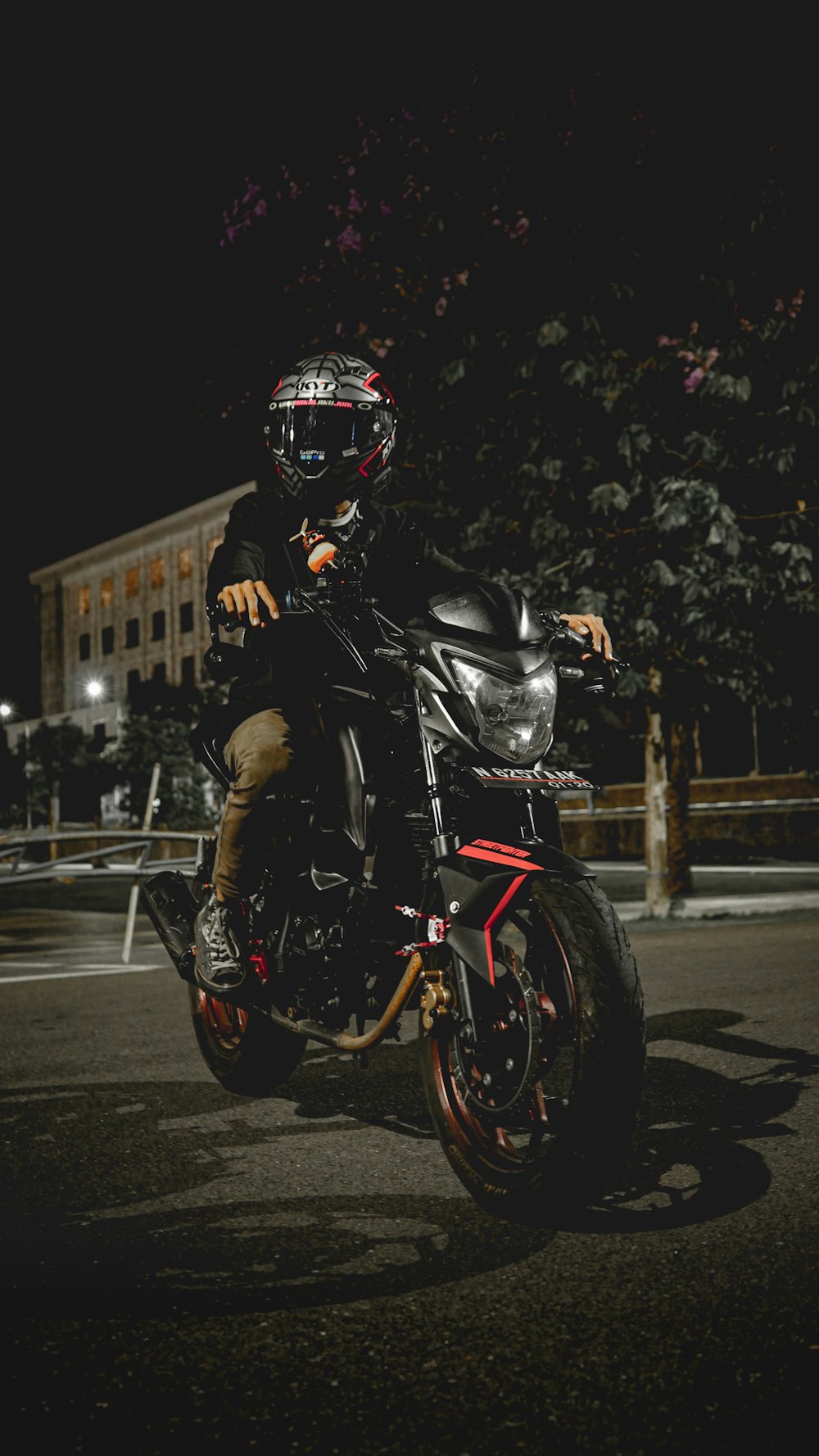 man in black motorcycle helmet riding motorcycle on road during daytime