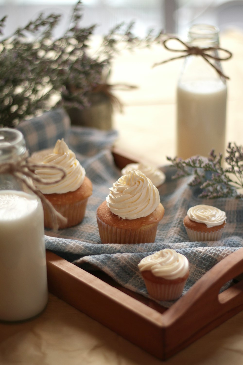 cupcakes on brown wooden tray