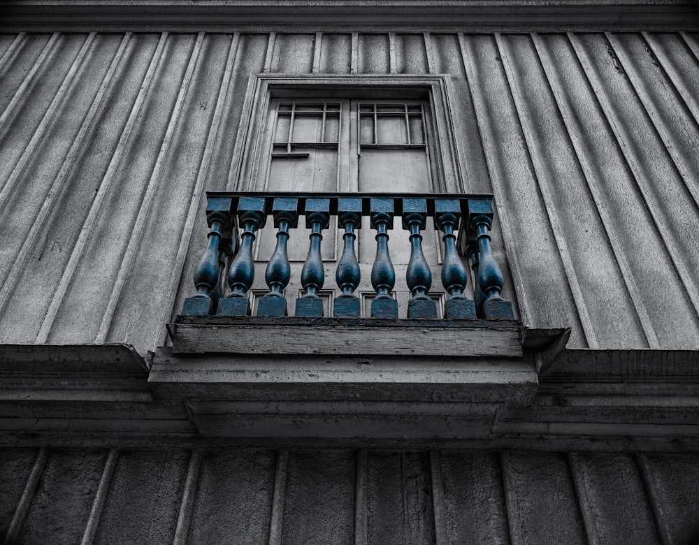 blue glass bottle on window