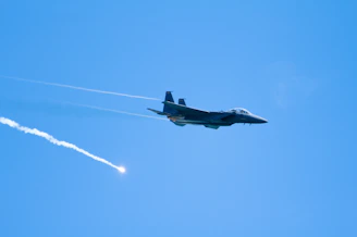 A Pakistan Air Force fighter jet soaring in the sky during a training exercise.