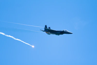 A Pakistan Air Force fighter jet soaring in the sky during a training exercise.