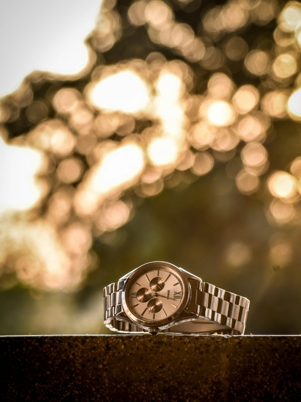 silver and gold analog watch