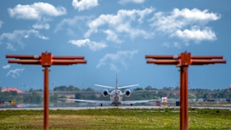 white and red airplane under blue sky during daytime