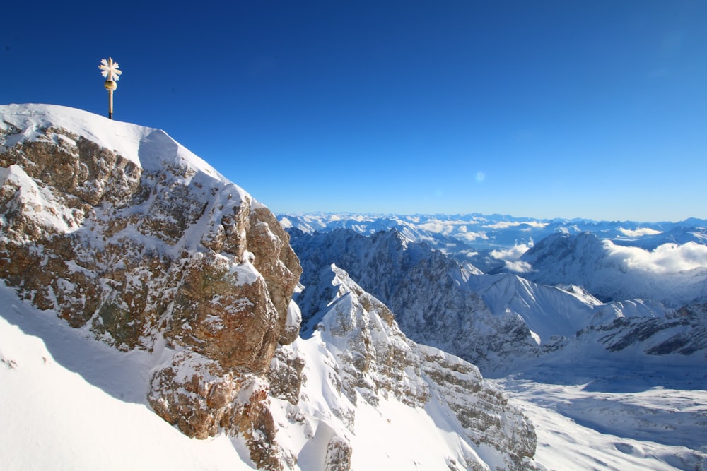 snow covered mountain under blue sky during daytime