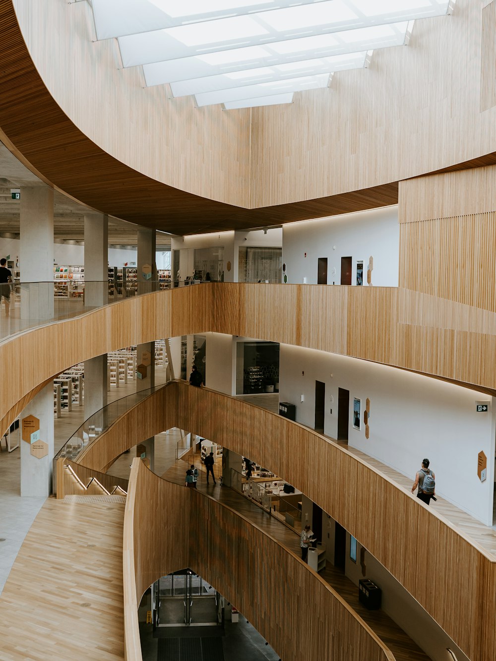 people walking on hallway inside building