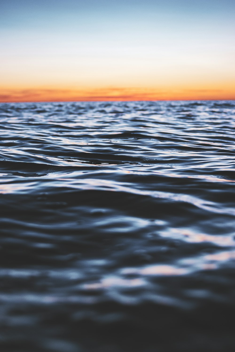 body of water during sunset