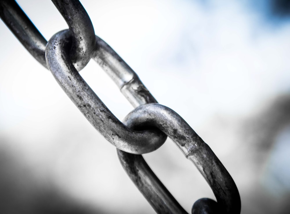 gray metal chain in close up photography