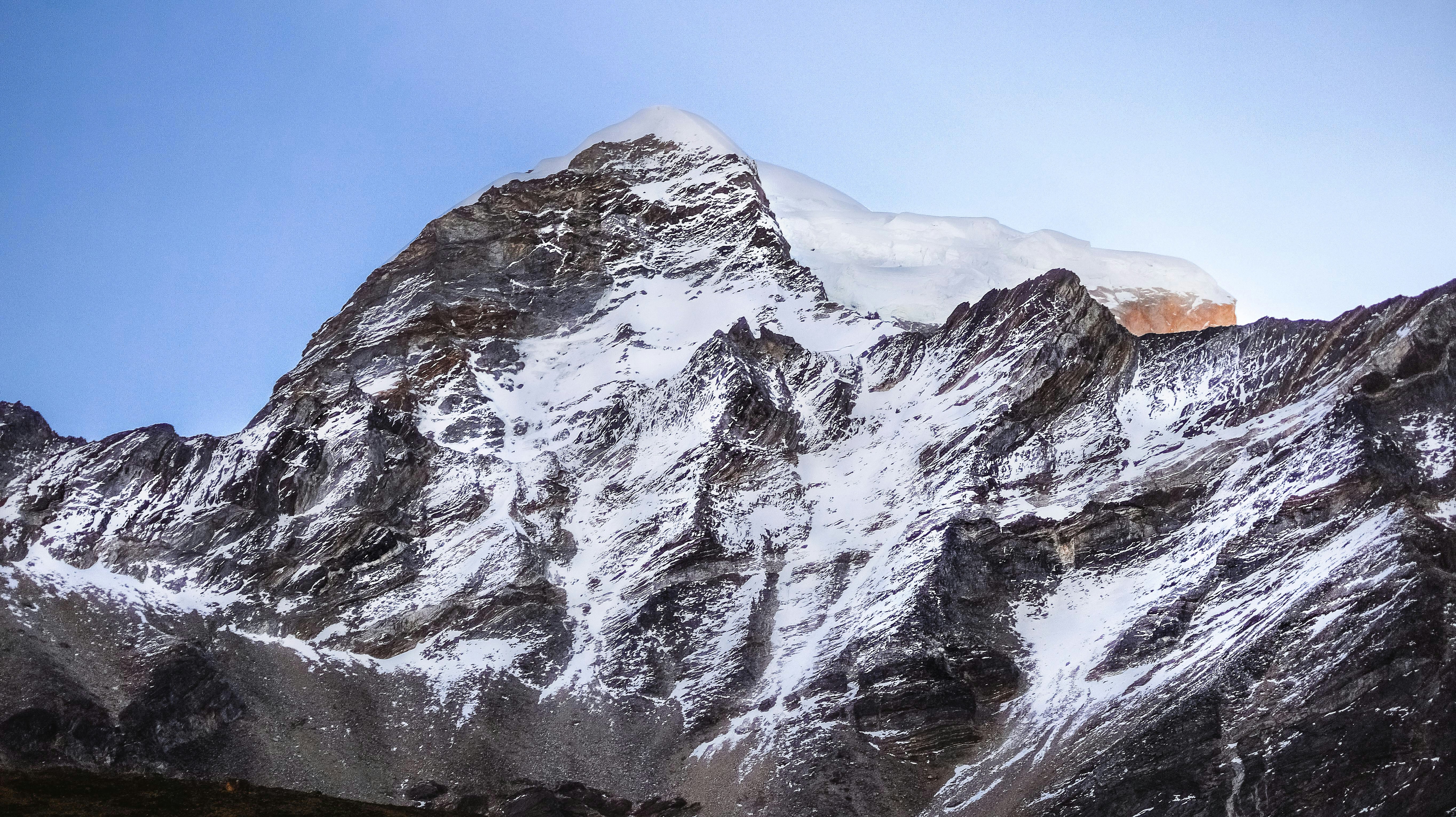 snow covered mountain under blue sky during daytime