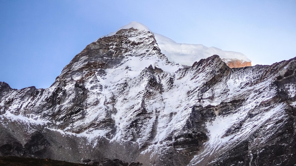 snow covered mountain under blue sky during daytime