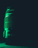 Close-up of a camera lens focusing on a dramatic scene under natural light.