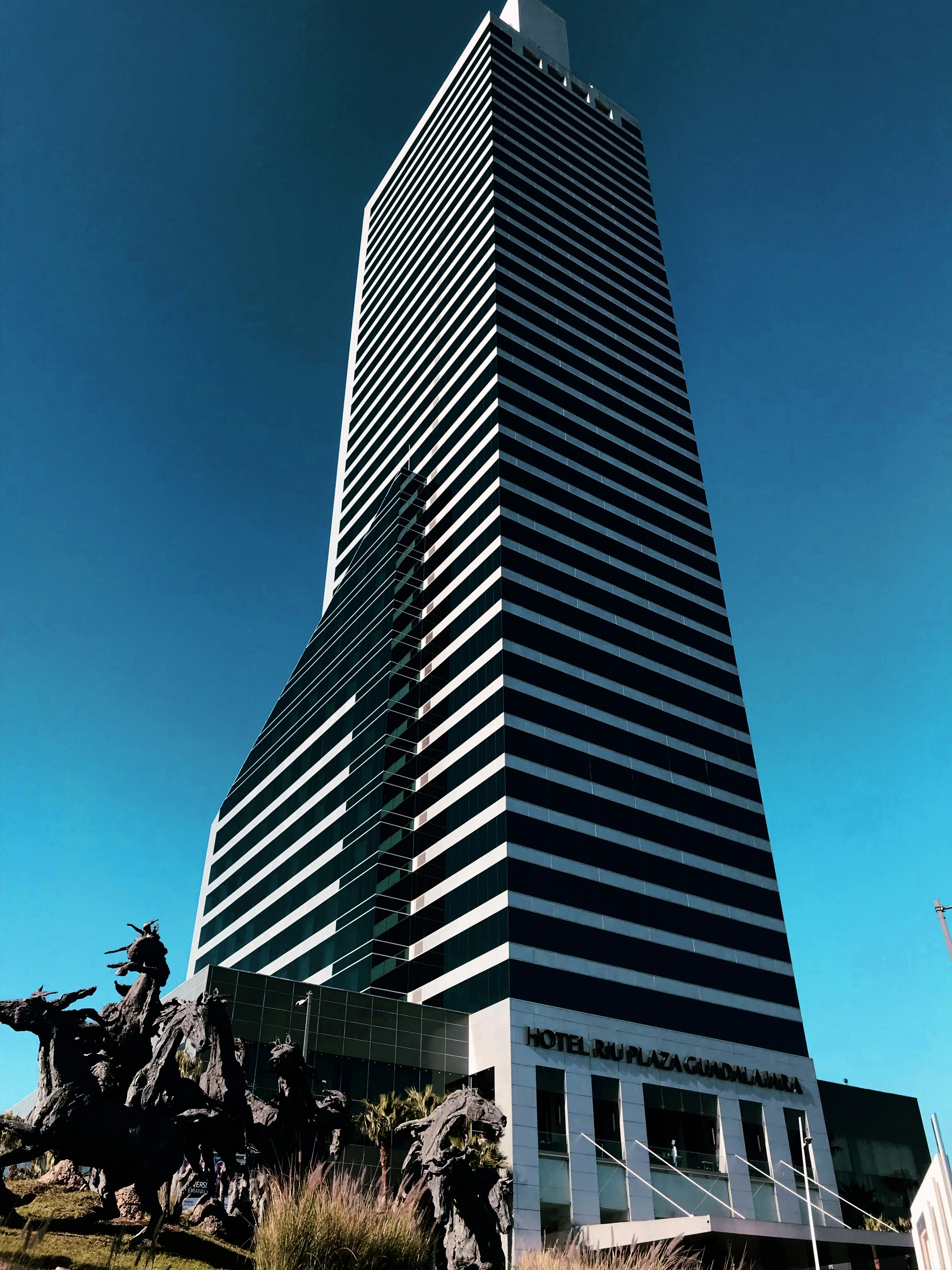 gray concrete building under blue sky during daytime