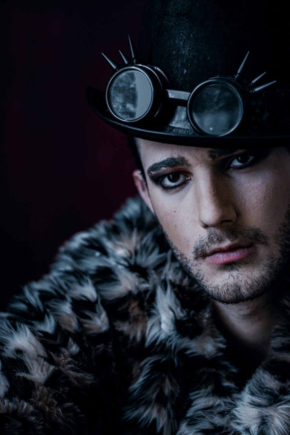 man wearing black and white fur coat and black and white cap