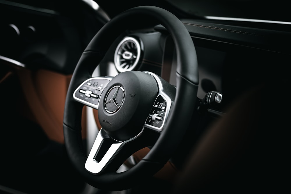 black and silver mercedes benz steering wheel
