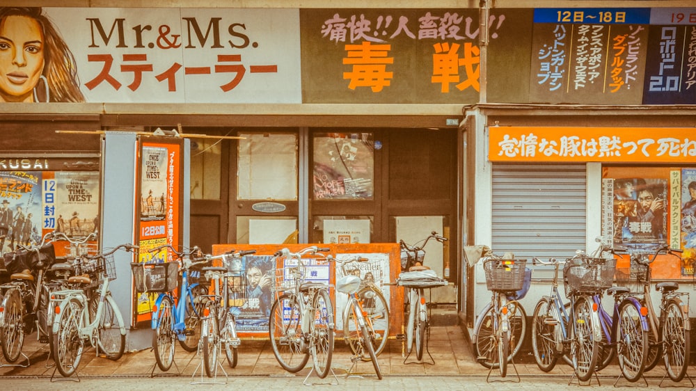 blue city bike parked beside brown wooden table