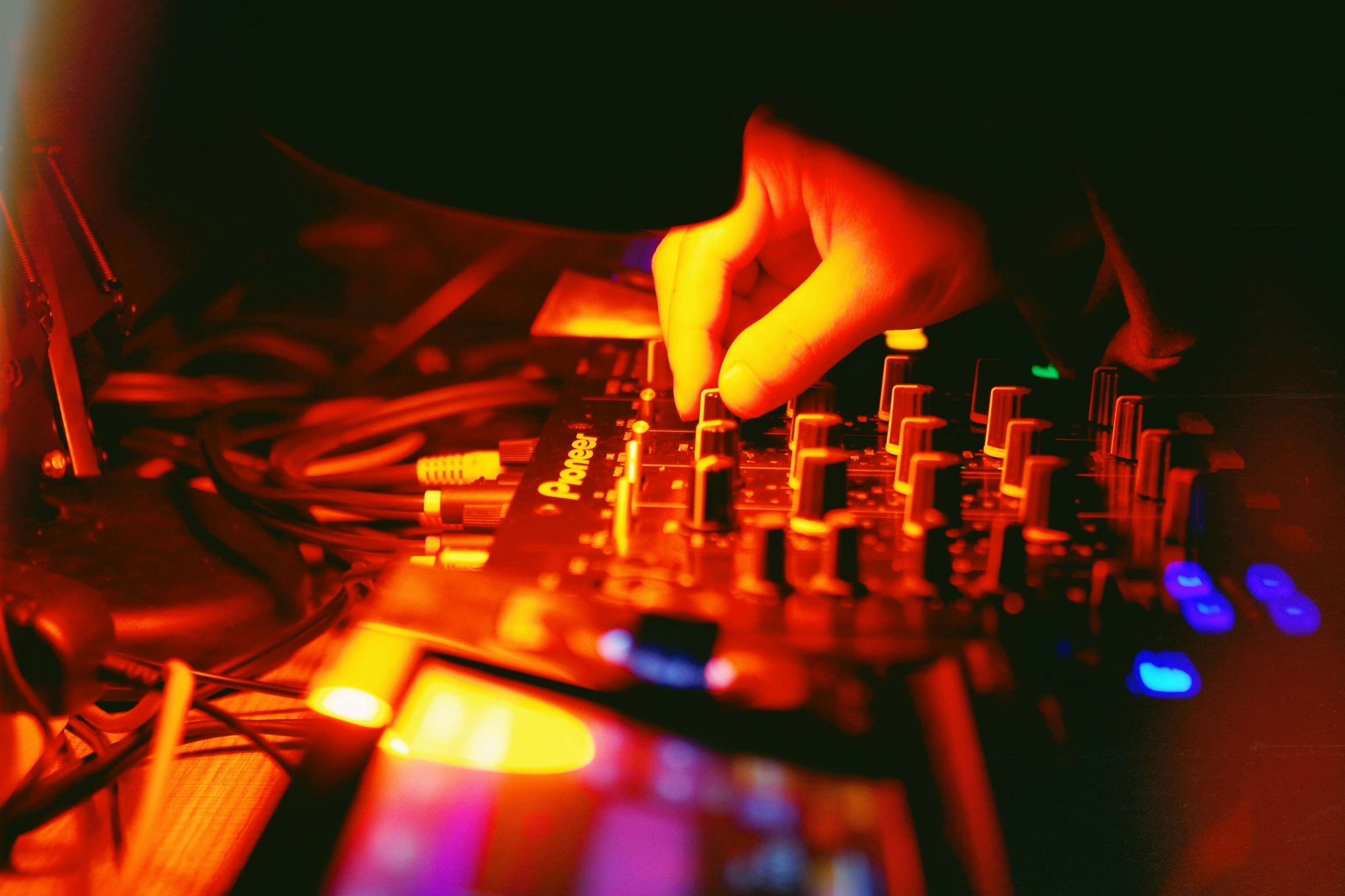person playing audio mixer in close up photography