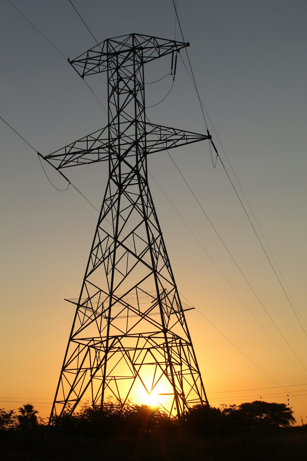 black electric tower under blue sky