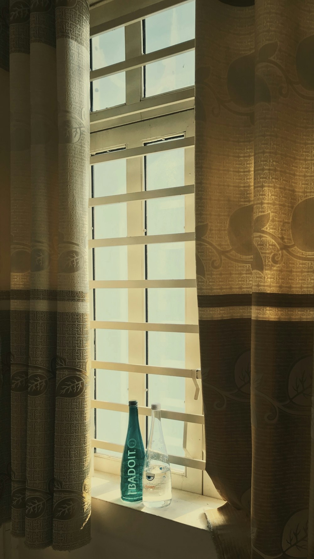 brown window curtain during daytime