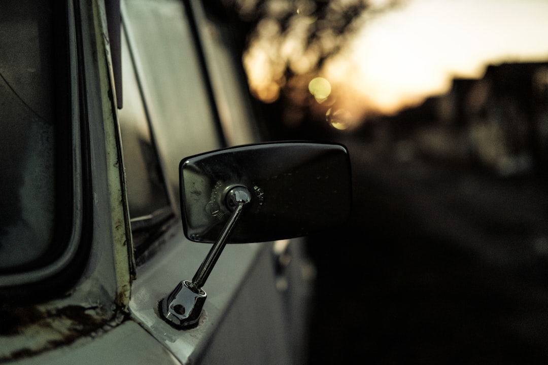 black car side mirror during sunset