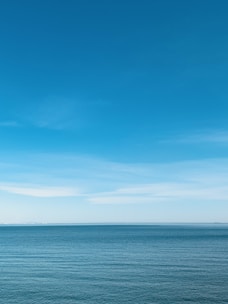 blue sea under blue sky during daytime