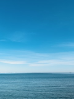 blue sea under blue sky during daytime