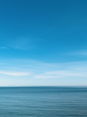 blue sea under blue sky during daytime