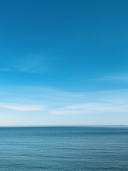 blue sea under blue sky during daytime