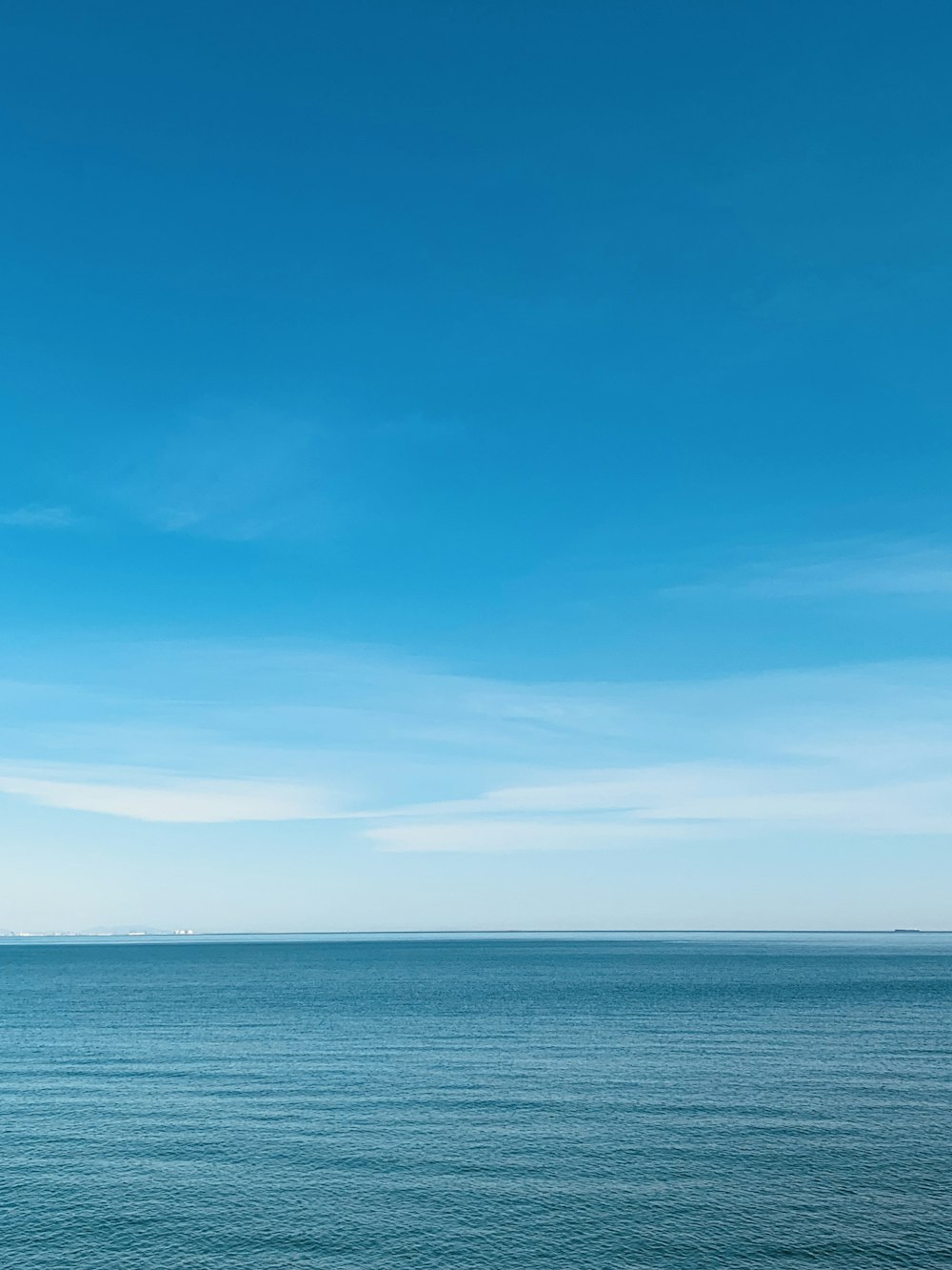 blue sea under blue sky during daytime