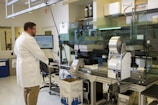 An environmental scientist analyzing samples at an industrial site.