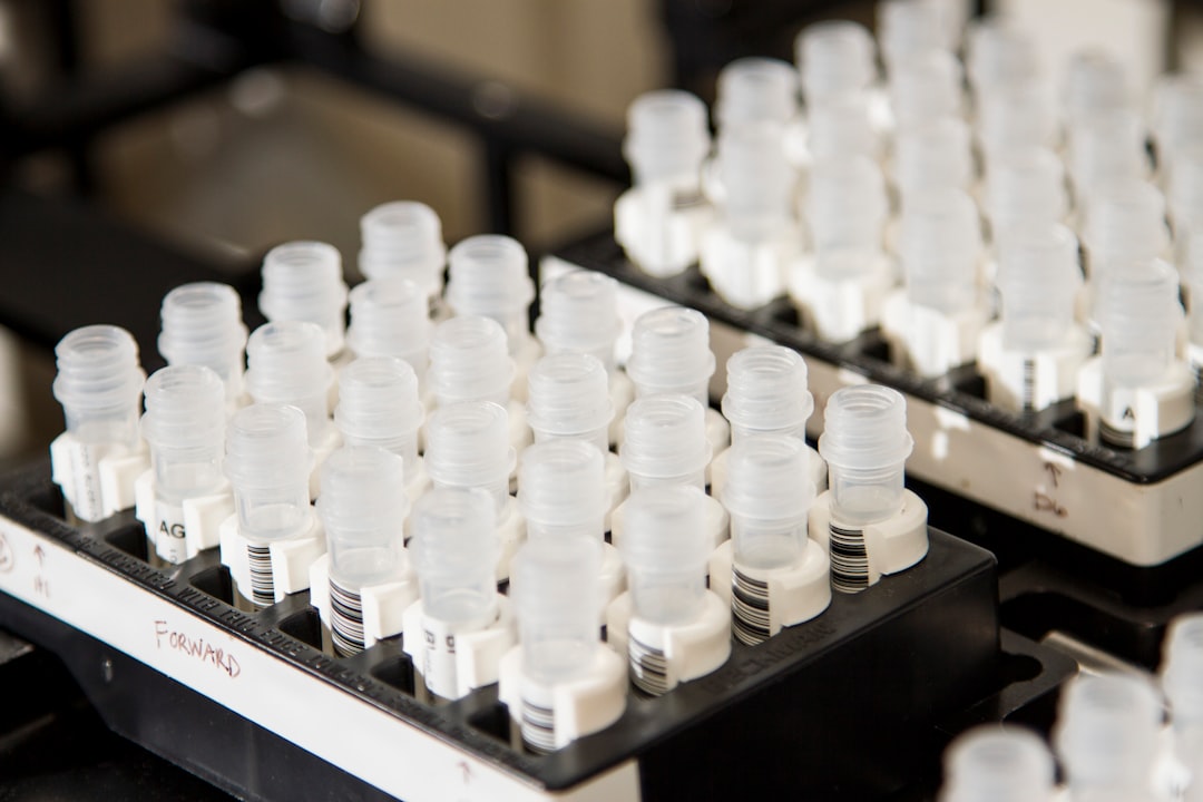 white plastic bottles on black shelf