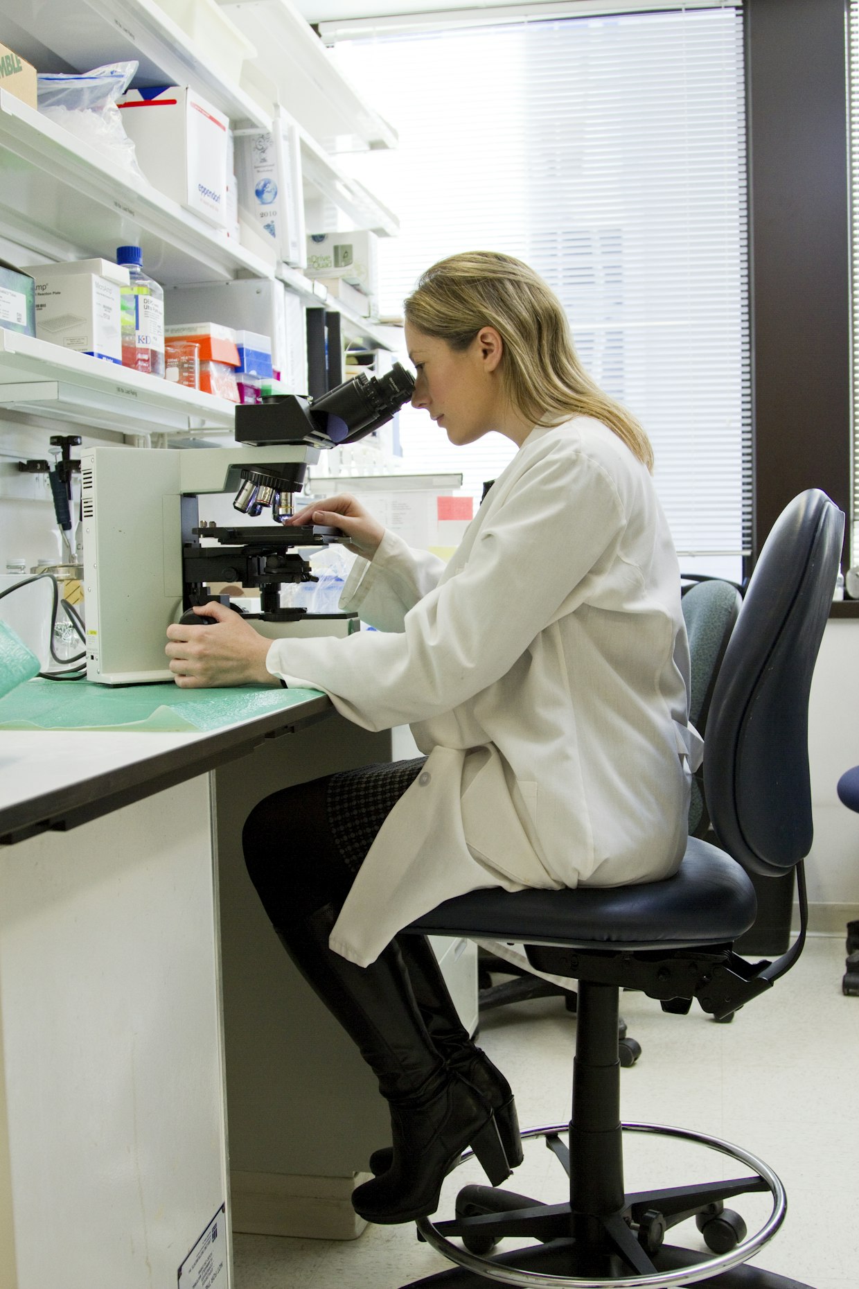 LMS for biotech organizations — large-scale regulated biotech manufacturing floor with trained compliance-ready staff